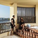 a couple talking by the jaccuzi at jaccuzi suite at fanar resort in hawana salalah oman