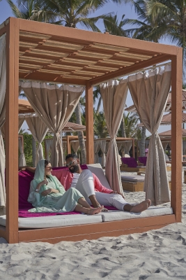 Couple setting on Juweira's beach 