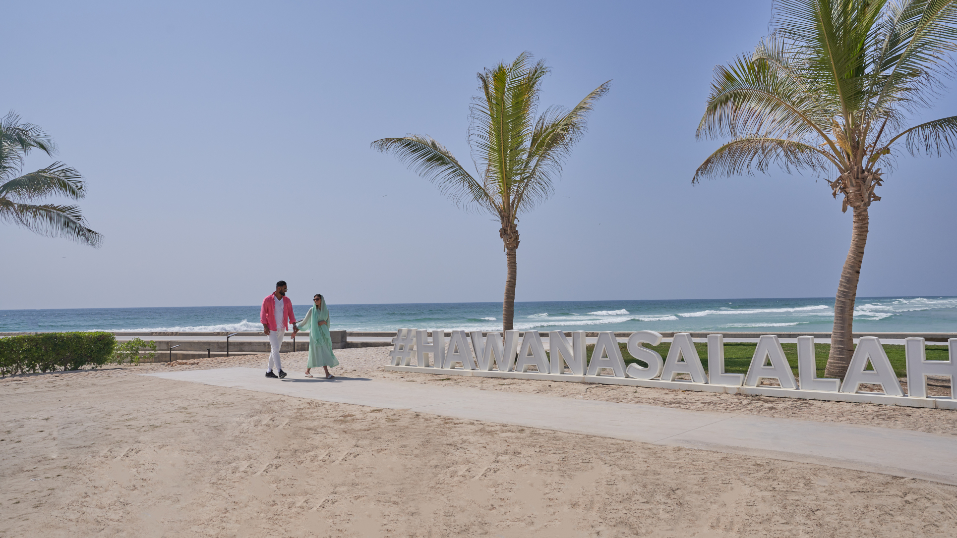 Juweira Boutique Hotel couple walking on the beach