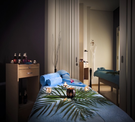 Zen the spa treatment room with warm lights at Rotana Salalah Oman