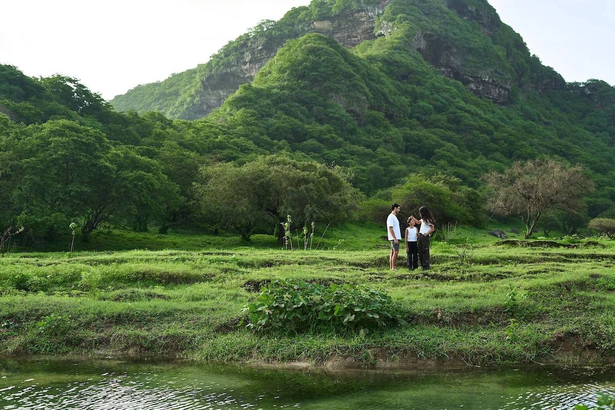 Family enjoying outdoor activities at Hawana Salalah during Khareef
