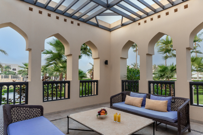 One Bedroom Suite Terrace with 2 sofas and table at Rotana Salalah Oman