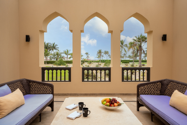 Two bedroom terrace with 2 sofas and table at Rotana Salalah Oman