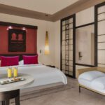 Spacious Family Ocean View Rooms with king bed, sofa bed and small table at Rotana Salalah Oman