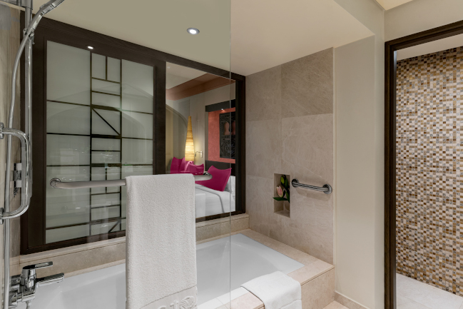 Spacious family ocean view room bathroom with a shower room at Rotana Salalah Oman