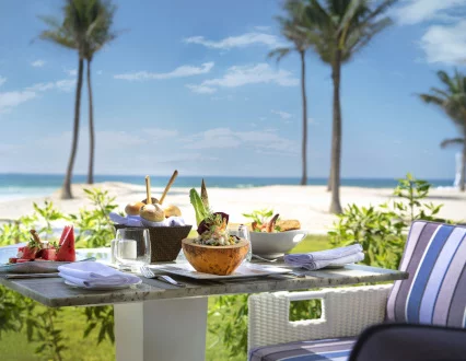 sitting area with a beach view at beach bar and restaurant in salalah rotana resort in hawana salalah