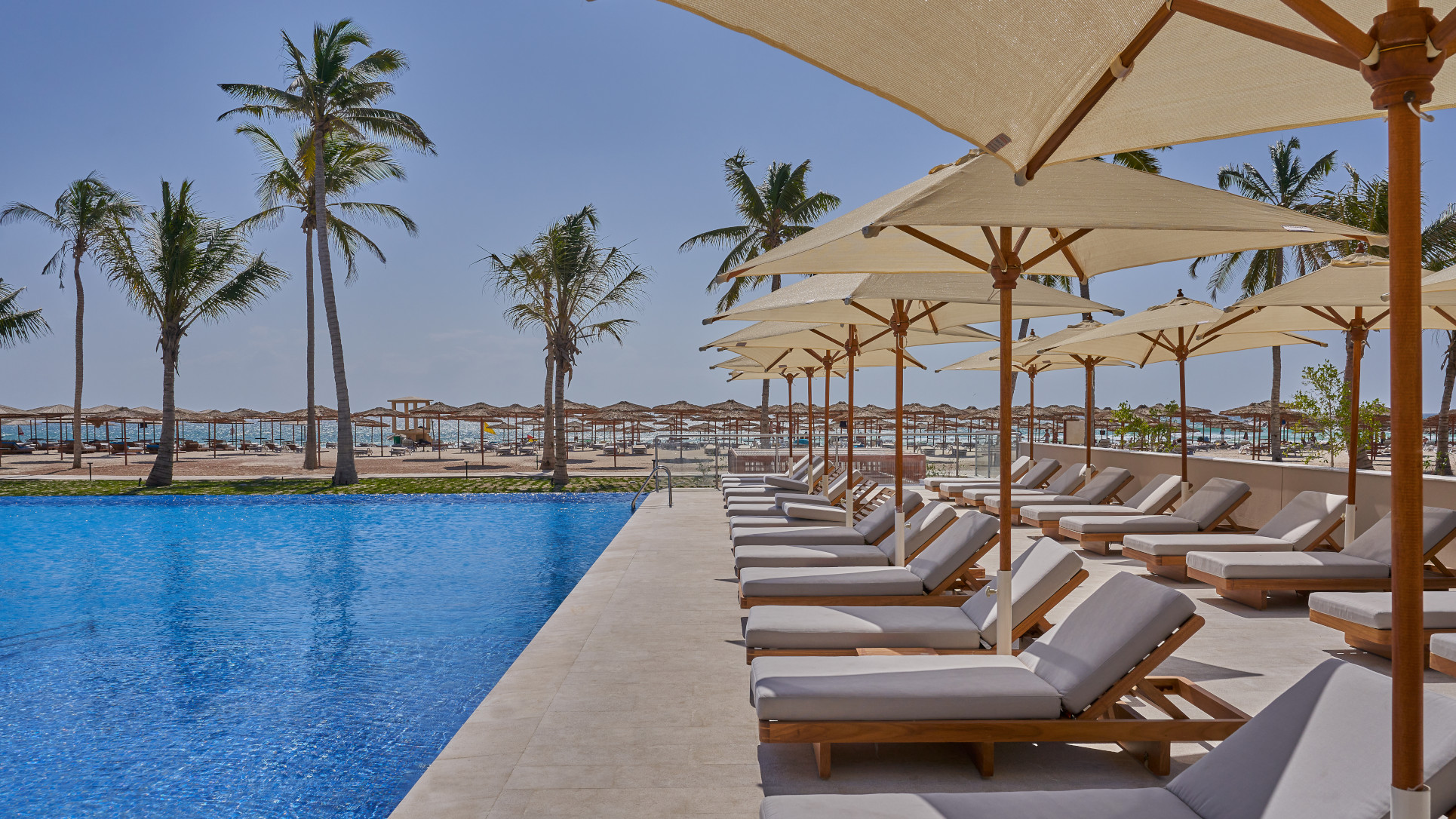 Pool and sunbeds at the Club By Fanar Hotel Salalah