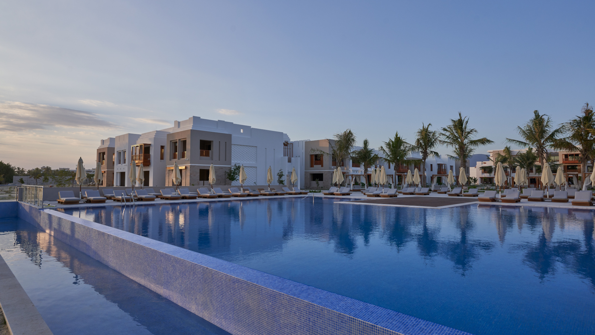 Overview for the pool and the buildings in the background for The Club By Fanar Hotel Salalah