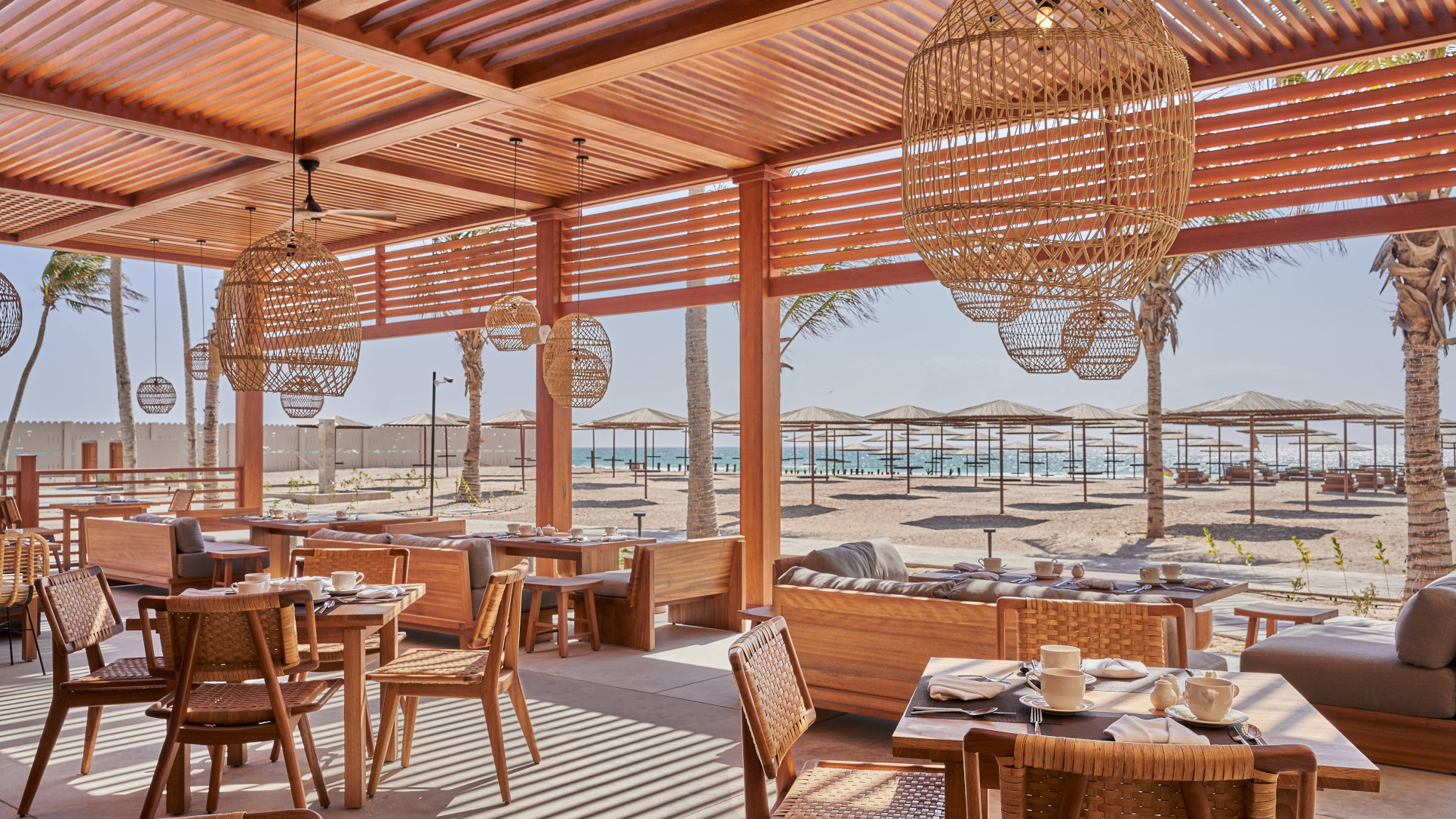 Waves Restaurant Tables with a sea view at the Club By Fanar Hotel Salalah.